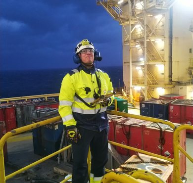 Tommy Eriksson finds working with technology an interesting part of fieldwork. Here he is using the digital fieldwork application on the Yme platform in the North Sea. Photo: Beerenberg.